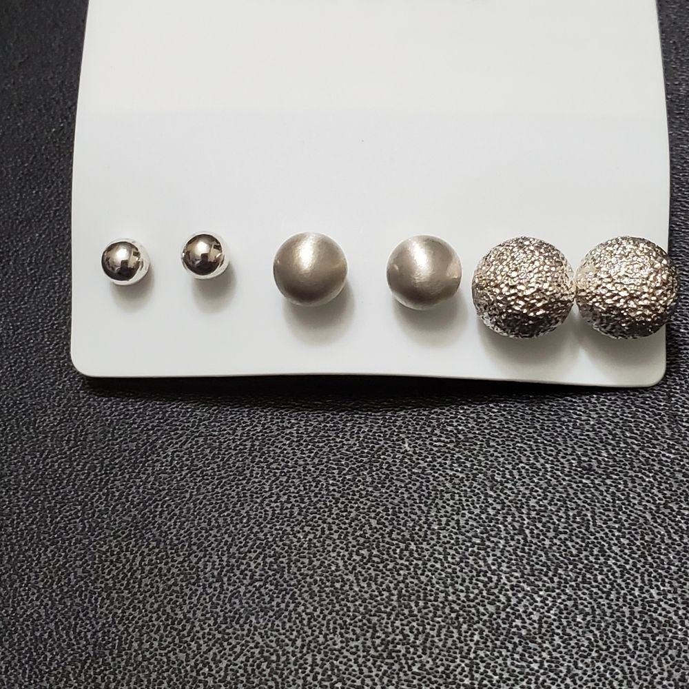 Silver tone round earring set of three